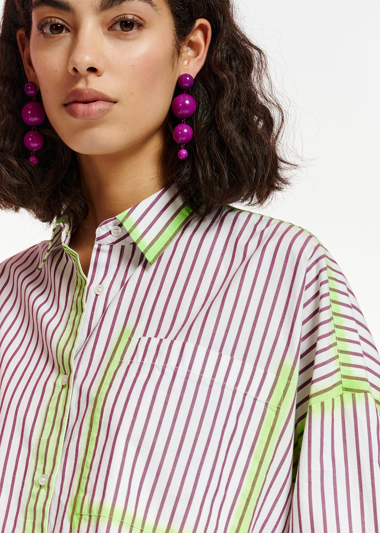 White and purple striped shirt with neon green airbrush strokes ...